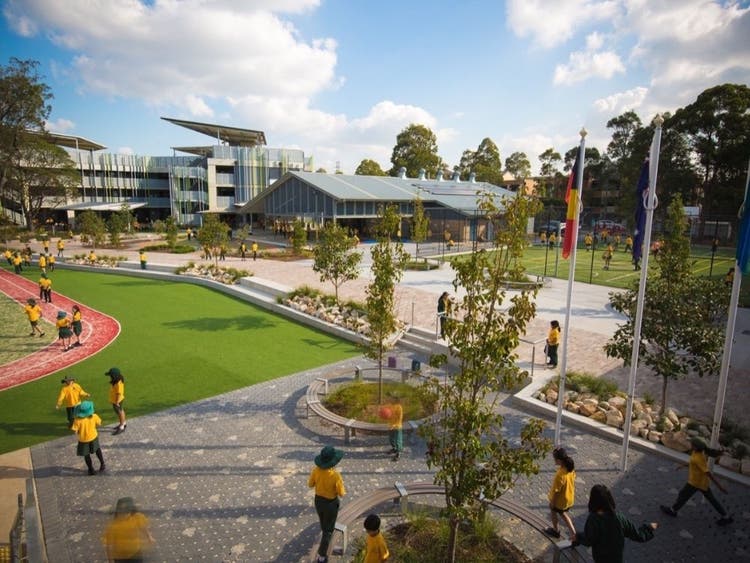 Students playing in the outdoor areas of the school campus.